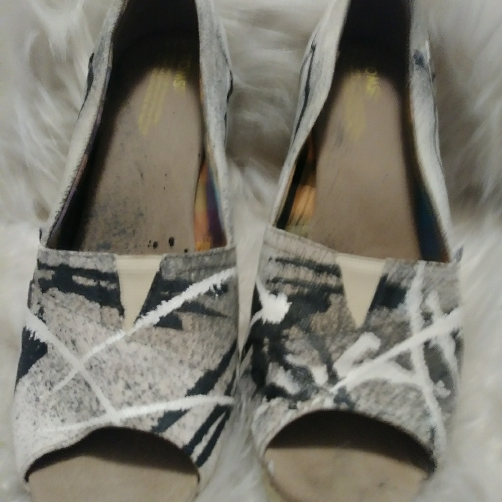 Women's multicolored TOMS wedge shoe.